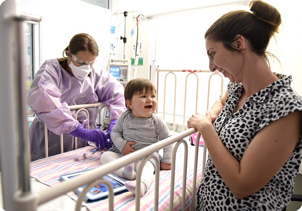 Baby smiling at mother - Sydney Children's Hospital Foundation Baby smiling at mother - Sydney Children's Hospital Foundation