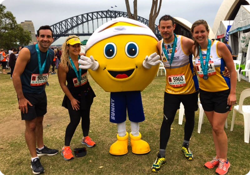 Blackmores Running Festival runners at the finish line with Sunny Blackmores Running Festival runners at the finish line with Sunny