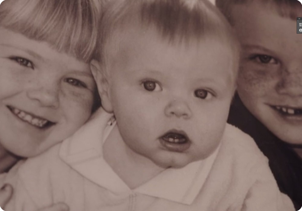 A photo of Charlie as a toddler with his brother and sister A photo of Charlie as a toddler with his brother and sister